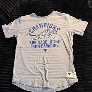 Under Armour Men’s Light Gray Tee with Blue 'Champions' Graphic